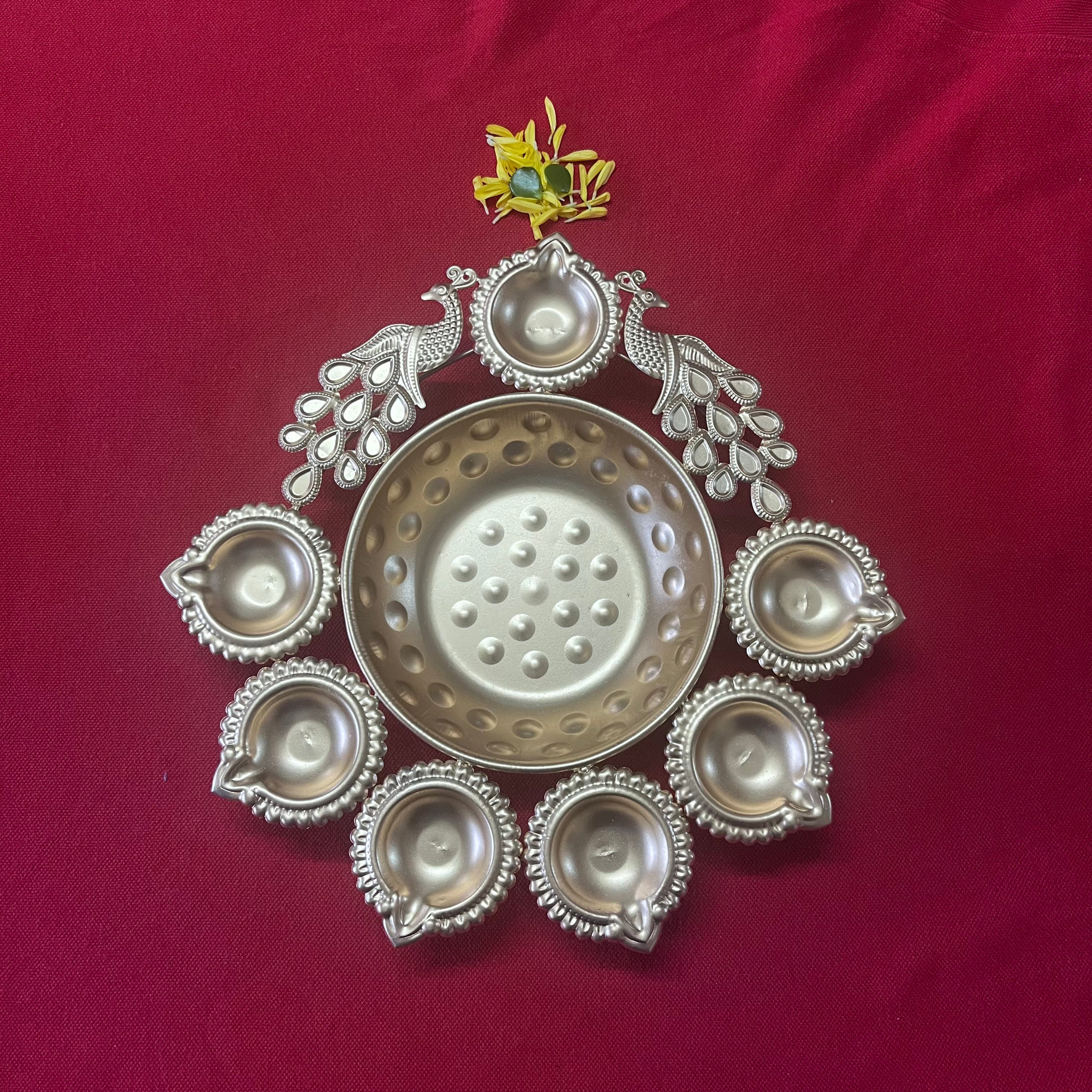 Urli with Diya and Peacock Figurines