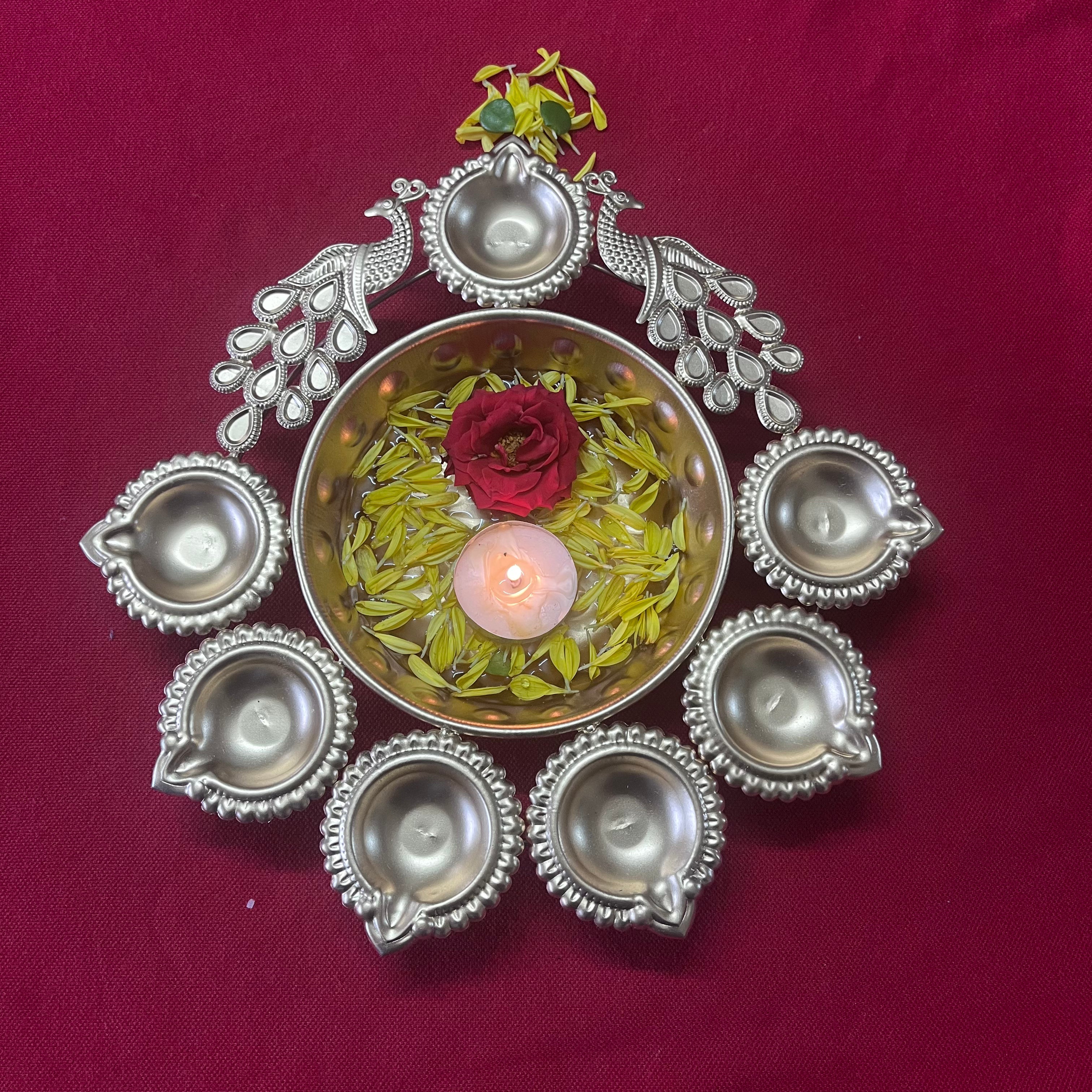 Urli with Diya and Peacock Figurines